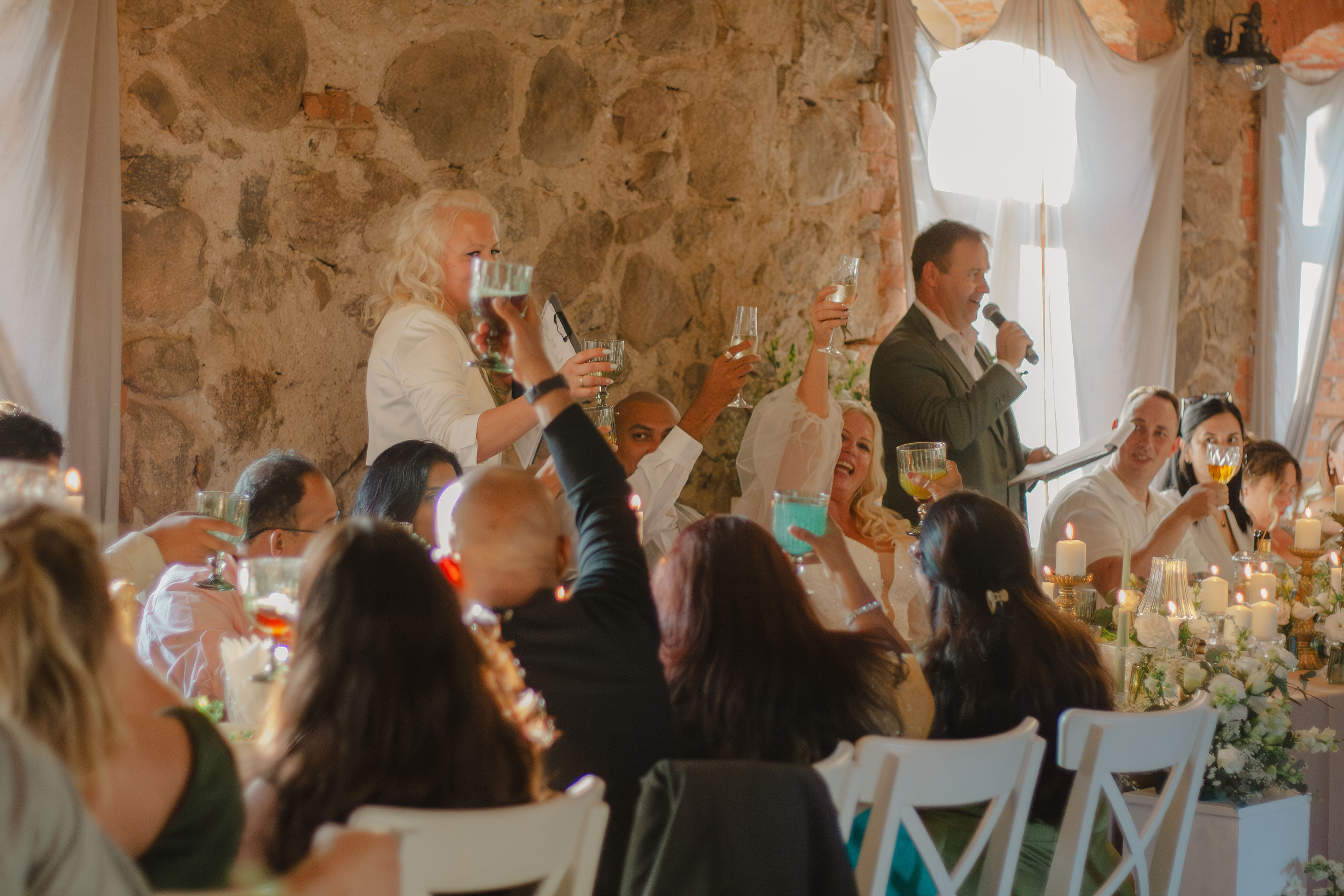 Wedding guests sharing a laugh